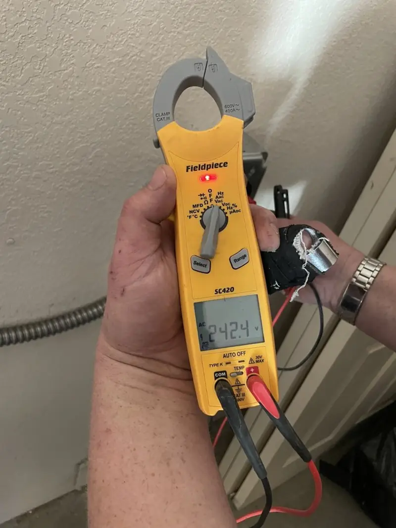 Voltage testing with clamp meter during Recessed Lighting Installation in St. John
